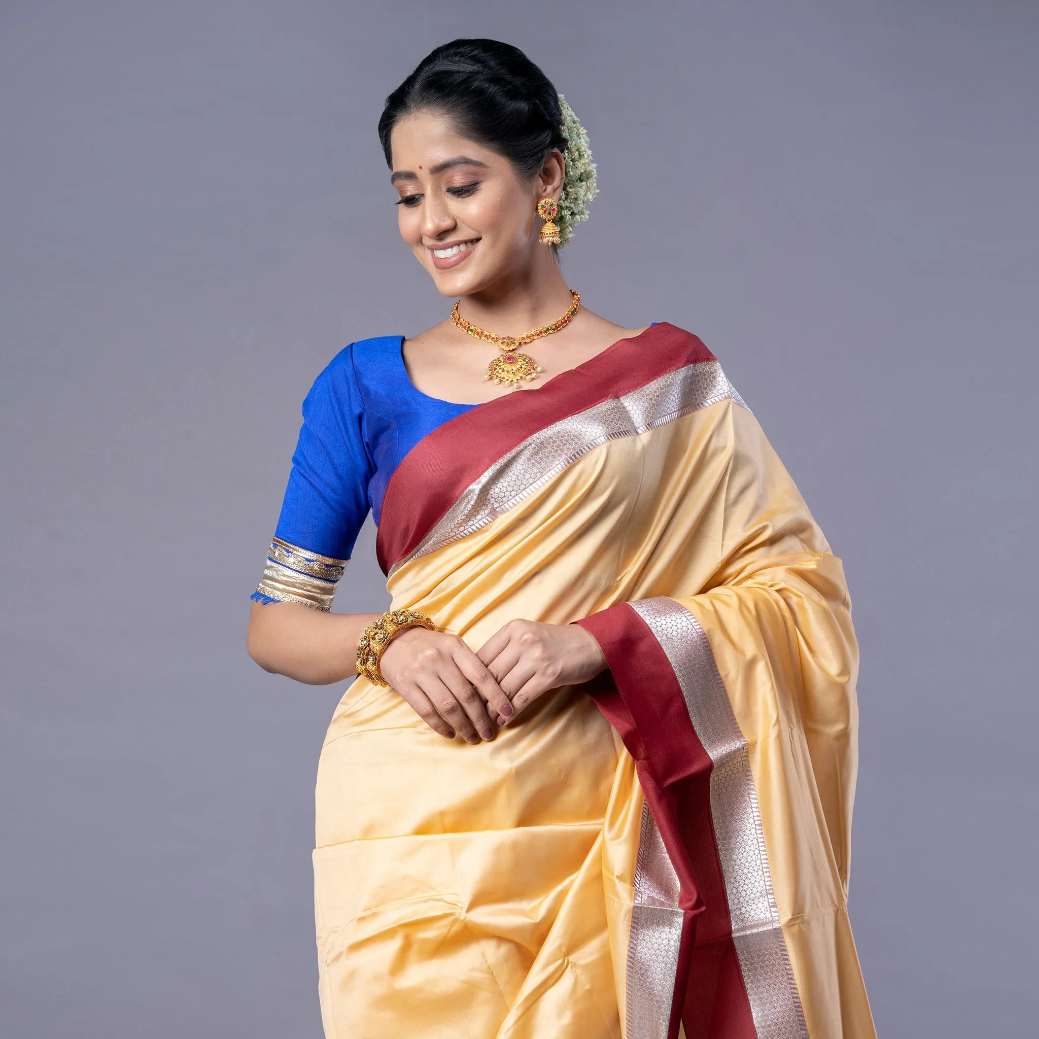 Women Kanjivaram Silk Saree In Beige Color With Maroon And Silver Border