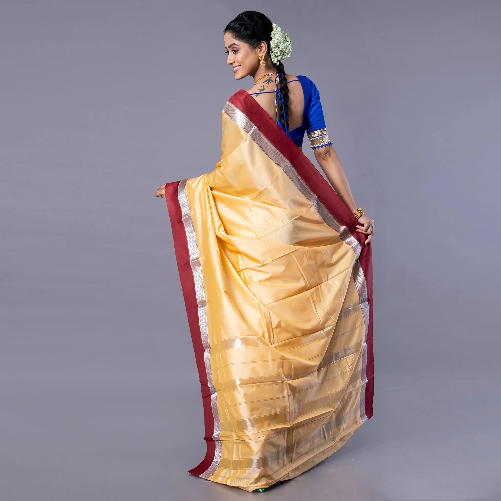 Women Kanjivaram Silk Saree In Beige Color With Maroon And Silver Border