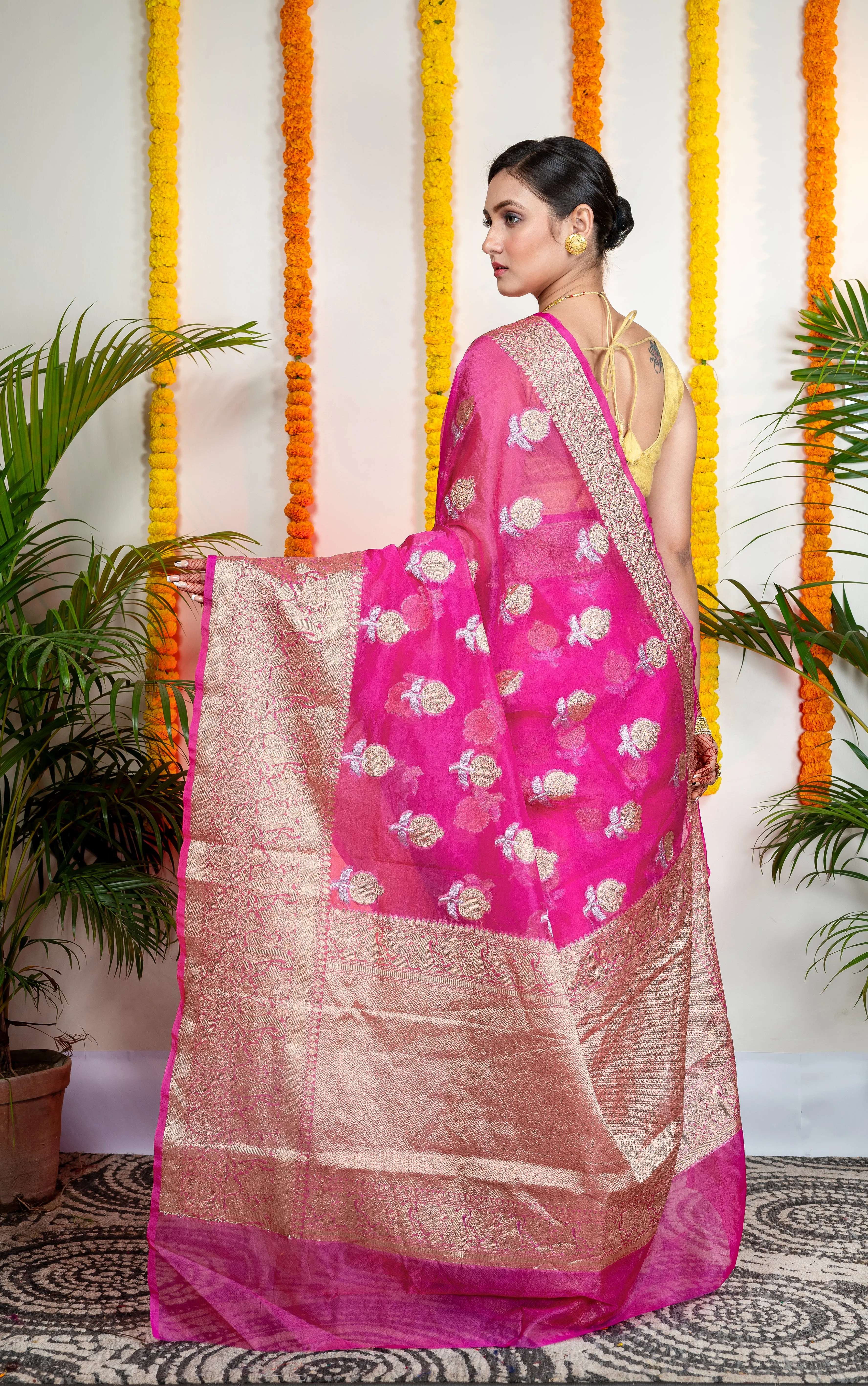 Women Pink Organza Silk Saree With Zari Border And Floral Motifs